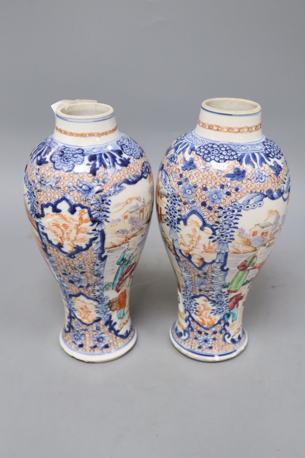 A pair of 18th century Chinese famille rose figural vases, height 25.5cm